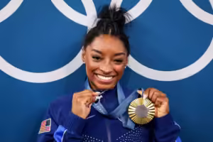 Simone Biles’ ‘GOAT’ Necklace Draws Attention at Olympics
