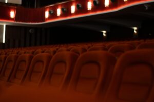A classic movie theater exterior with a marquee sign