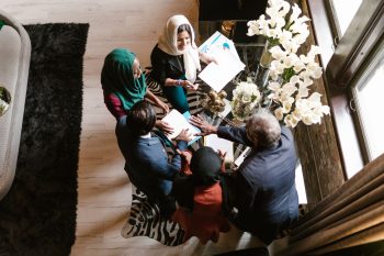 A diverse group of professionals collaborating around a table in an office setting