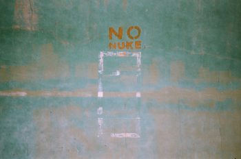 white and blue number 8 print on green wall