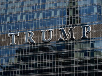 Detailed facade view of the Trump building with reflective glass windows