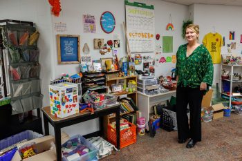 A person standing among shelves and displays of reusable supplies at See Use Again